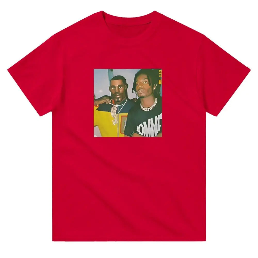 Red T-shirt displaying a graphic featuring two hip-hop figures, one in a yellow shirt with a prominent necklace and the other in a black shirt with bold white text. Carti Perc Battle Royale Shirt. The image has a retro, meme-inspired aesthetic, resonating with fans of hip-hop culture and playful streetwear fashion.