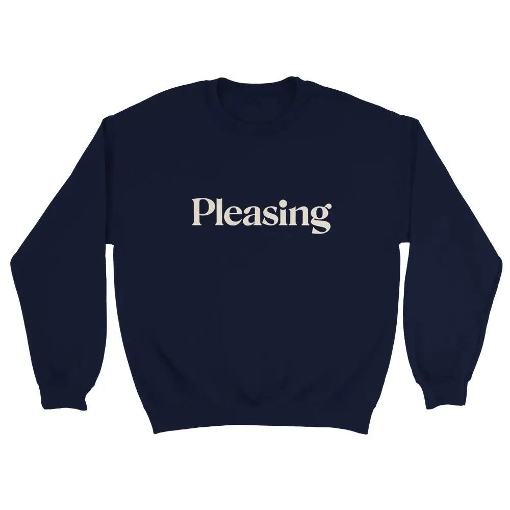 Blue sweatshirt featuring the word "Pleasing" in a stylish, serif font across the chest. The minimalist design references the branding associated with Harry Styles, appealing to fans of his aesthetic and brand. The overall look is simple yet trendy.