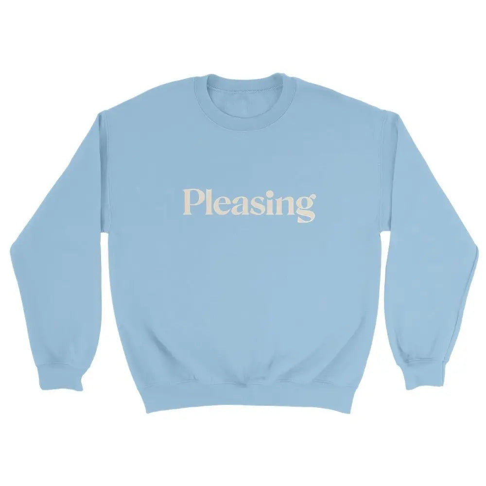 Blue sweatshirt featuring the word "Pleasing" in a stylish, serif font across the chest. The minimalist design references the branding associated with Harry Styles, appealing to fans of his aesthetic and brand. The overall look is simple yet trendy.